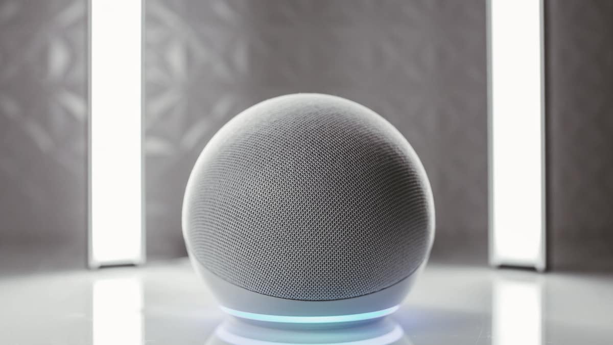 A spherical smart speaker on a kitchen counter