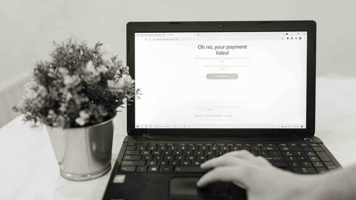 A person managing a subscription on a laptop at a desk