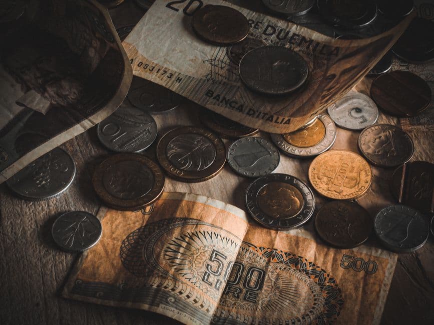 Assorted coins and banknotes on a table