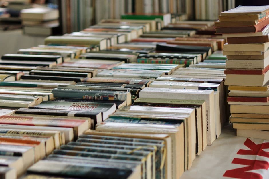 Rows of books arranged on a market stall