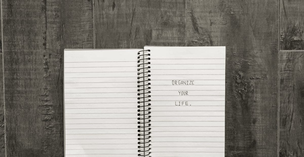 An open notebook of handwritten notes on a desk
