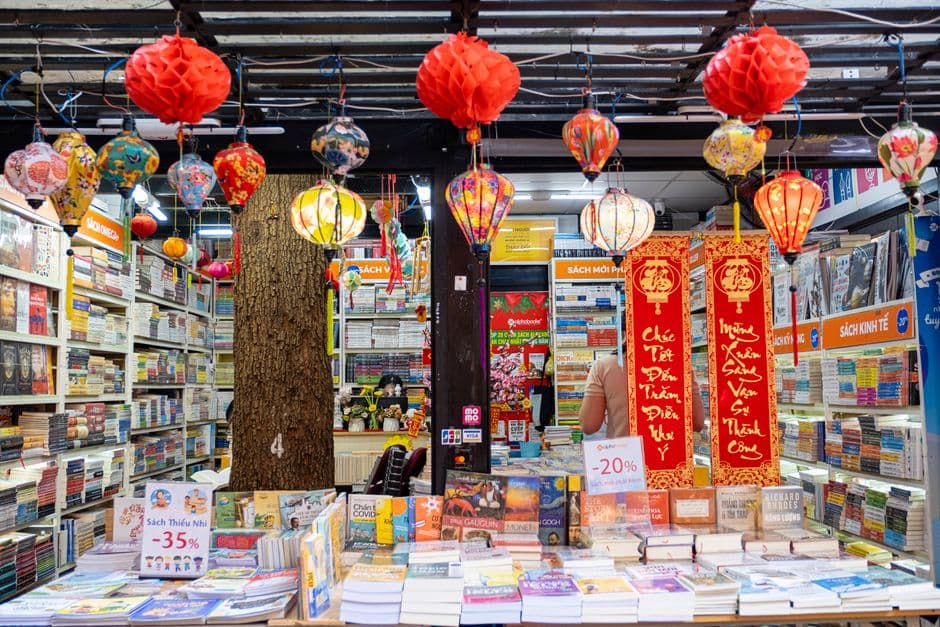Bookshelves stacked with discounted titles at a book market